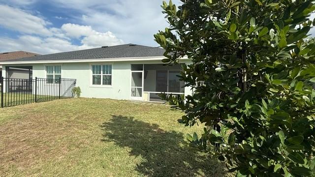 1353 Haywagon Tr. Loxahatchee, FL 33470 - Photo 21 of 34 front view of a house with a big yard