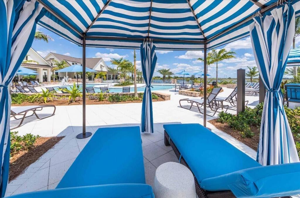 1353 Haywagon Tr. Loxahatchee, FL 33470 - Photo 23 of 34 a living room with large window