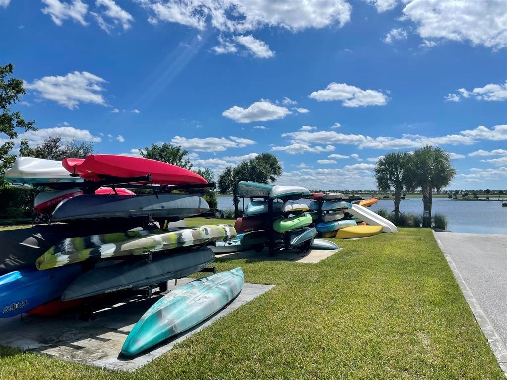 1353 Haywagon Tr. Loxahatchee, FL 33470 - Photo 26 of 34 a view of a backyard with swimming pool