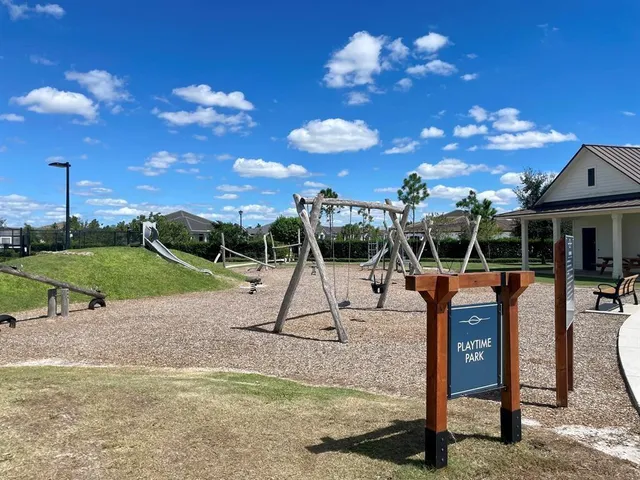 a view of a swimming pool with outdoor seating