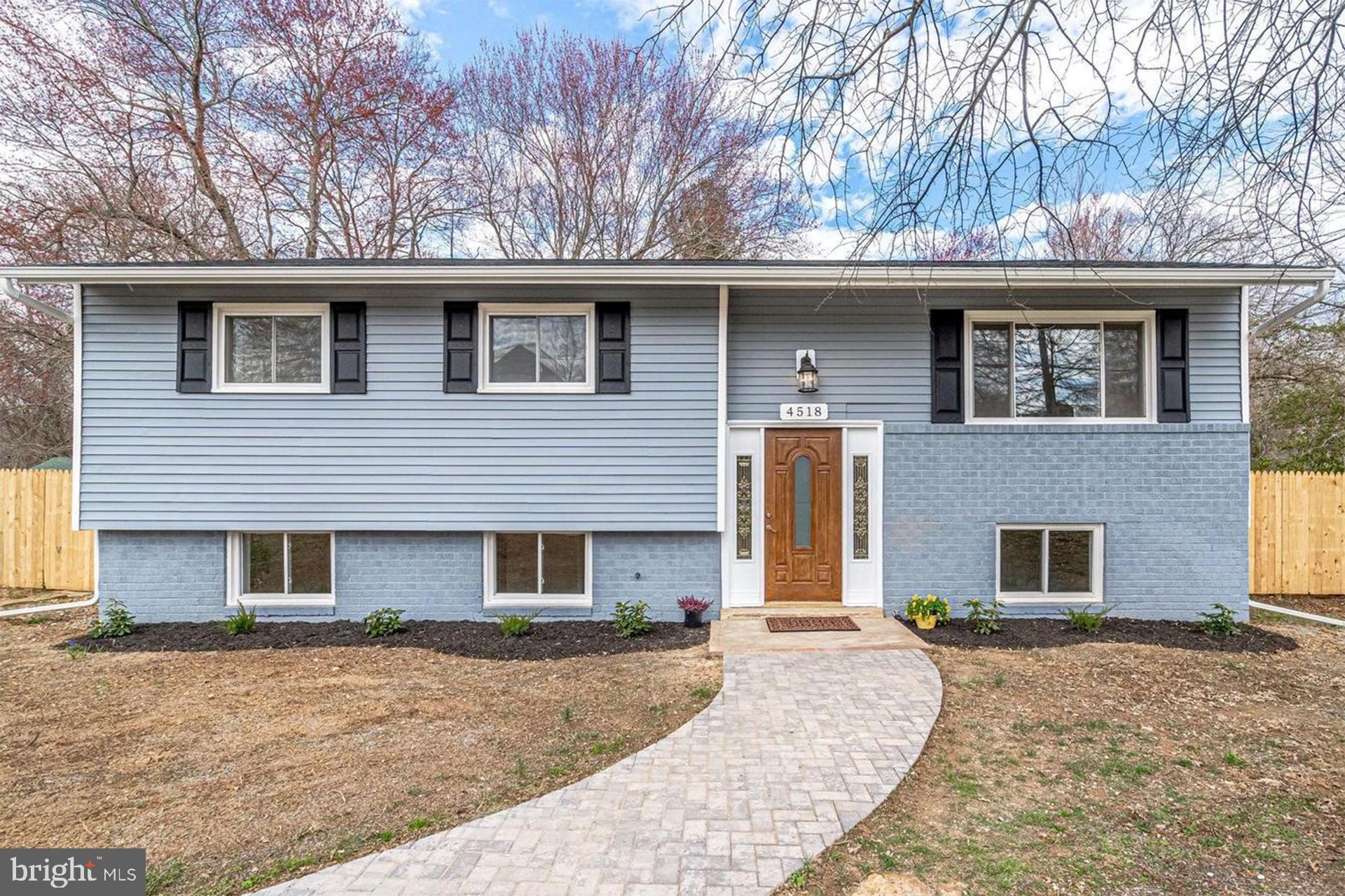 4518 Gage Road Alexandria, VA 22309 - Photo 2 of 42 a front view of a house with a yard and garage