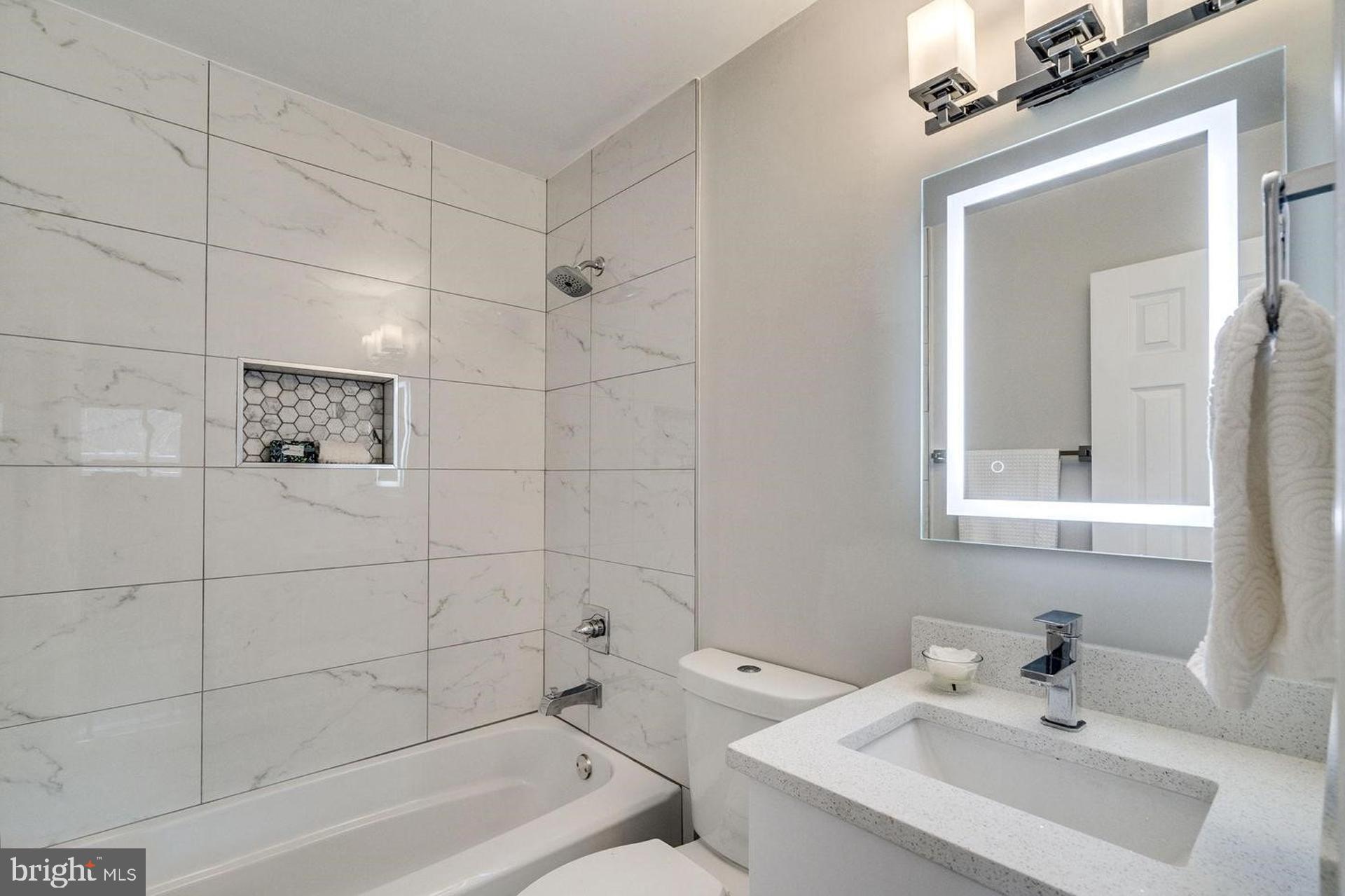 4518 Gage Road Alexandria, VA 22309 - Photo 21 of 42 a bathroom with a sink and a bathtub