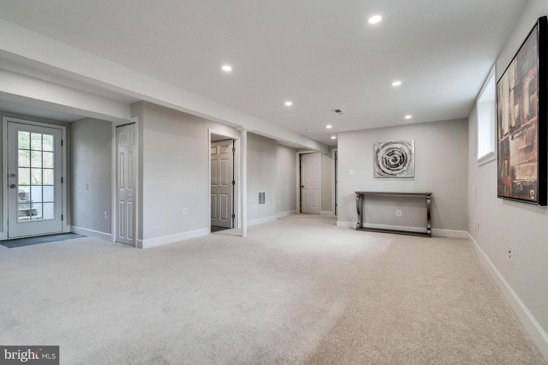 4518 Gage Road Alexandria, VA 22309 - Photo 24 of 42 a view of an empty room with a fireplace and window
