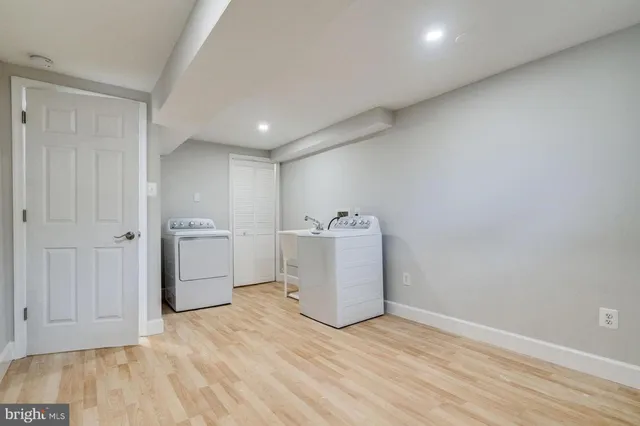 a view of a storage & utility room with wooden floor