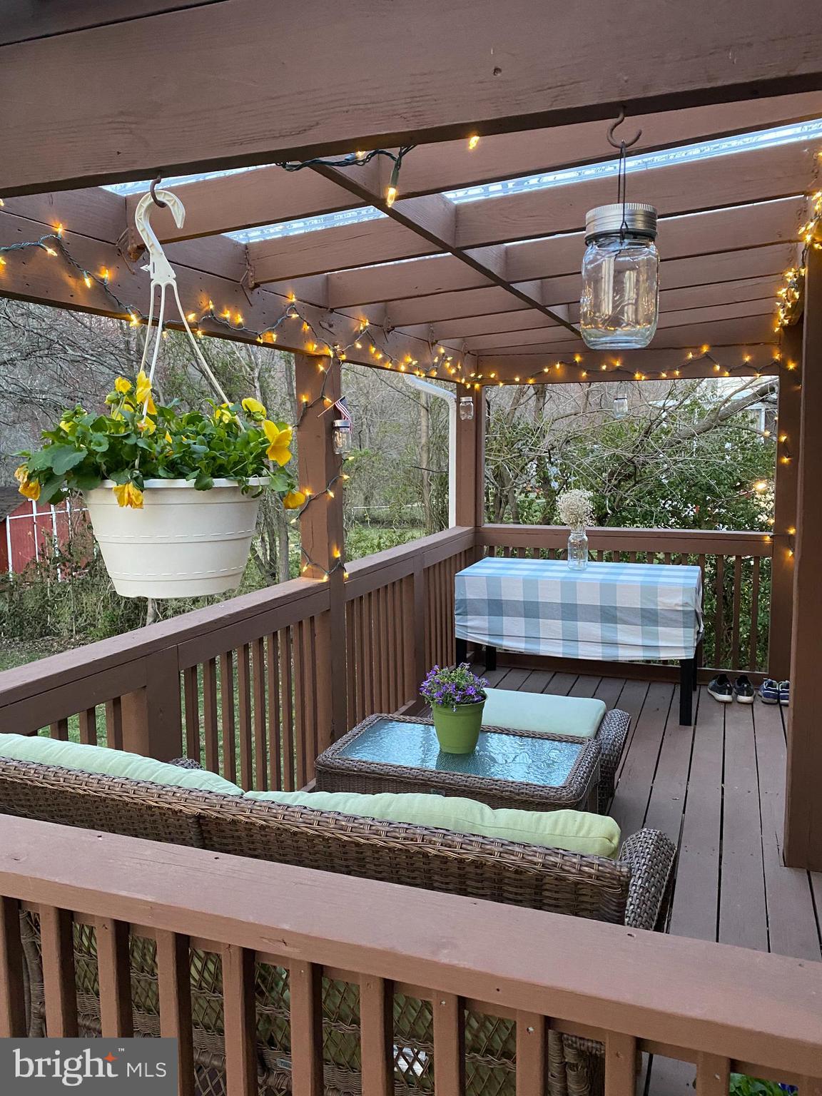 4518 Gage Road Alexandria, VA 22309 - Photo 34 of 42 a view of balcony with wooden floor and outdoor seating