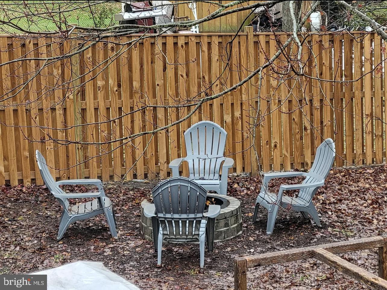 4518 Gage Road Alexandria, VA 22309 - Photo 37 of 42 a wooden bench sitting in backside of a house
