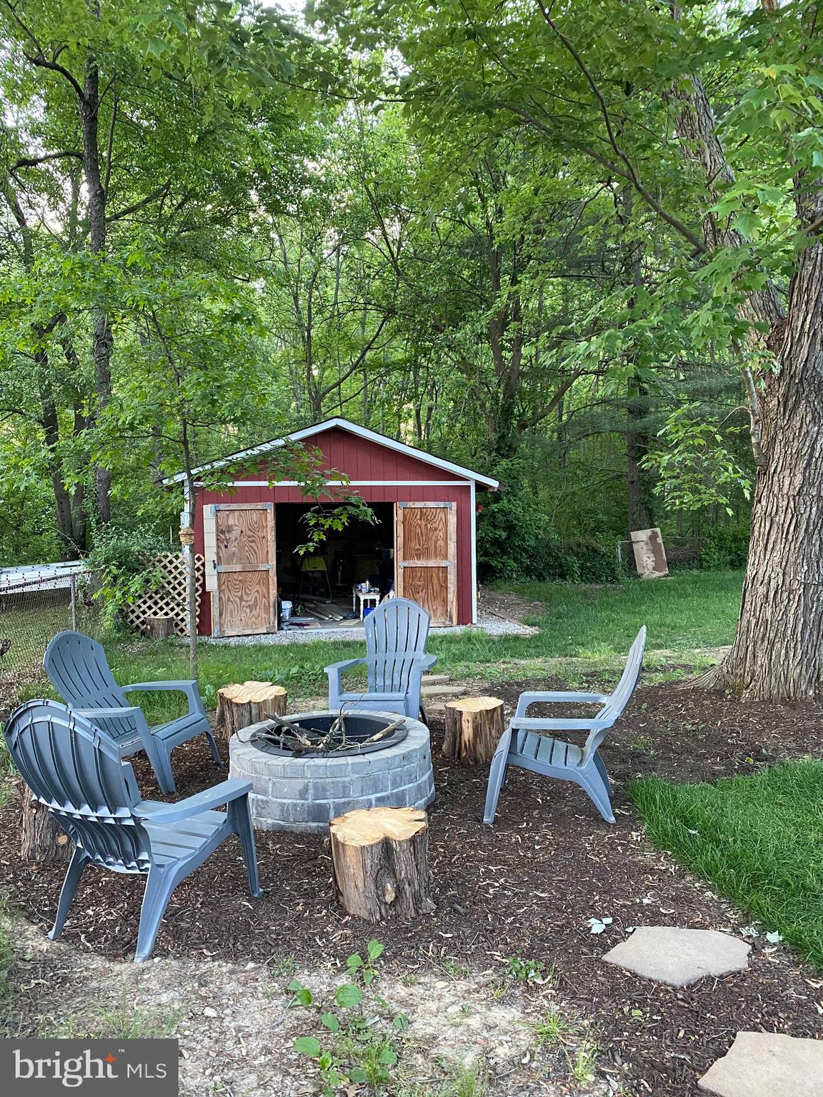 4518 Gage Road Alexandria, VA 22309 - Photo 39 of 42 a view of a house with backyard sitting area and garden