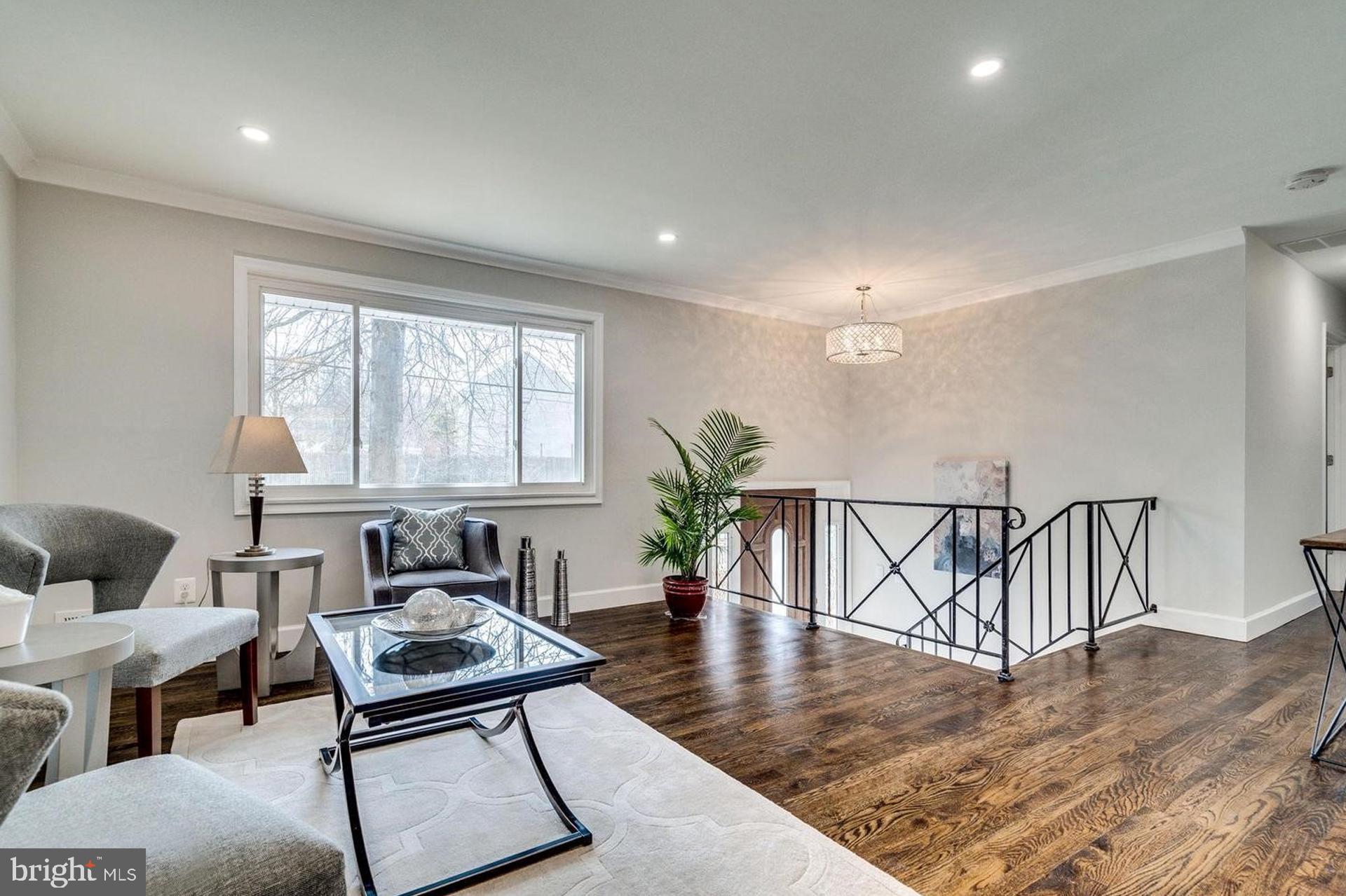 4518 Gage Road Alexandria, VA 22309 - Photo 5 of 42 a living room with furniture a window and wooden floor