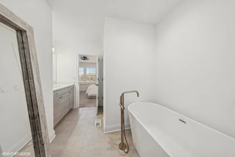 a bathroom with a tub and shower