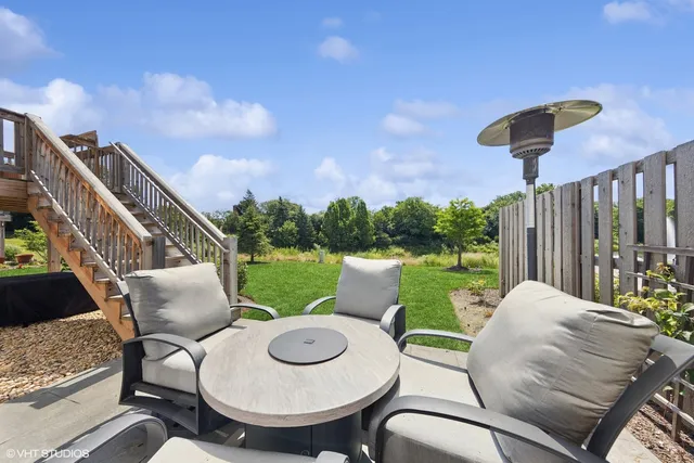 a view of a patio in the backyard