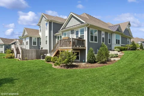 a view of a house with a yard and plants