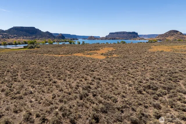a view of an ocean and a mountain