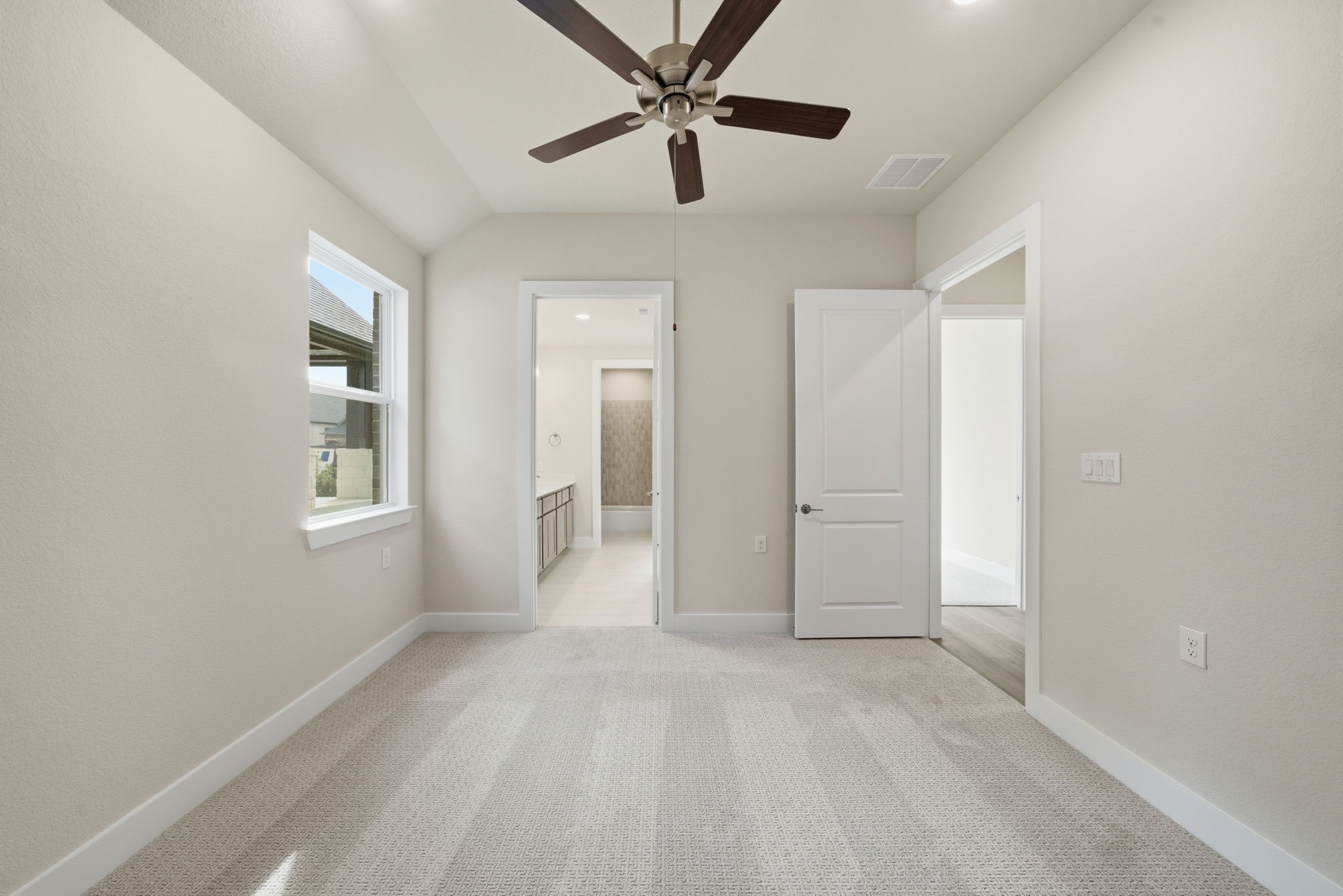 10026 Larkin Cove Willis, TX 77318 - Photo 23 of 46 a view of a livingroom with a ceiling fan and window