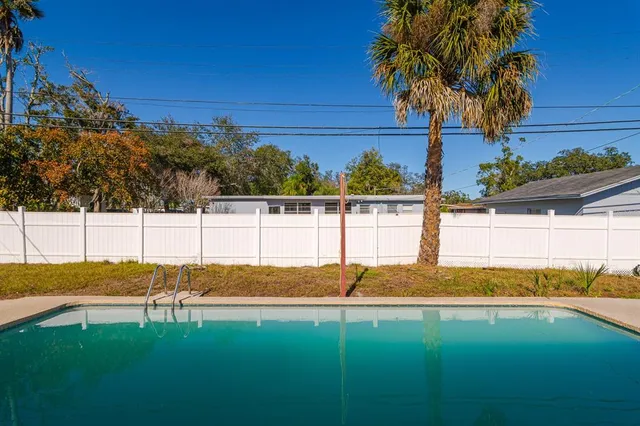 swimming pool view with seating space