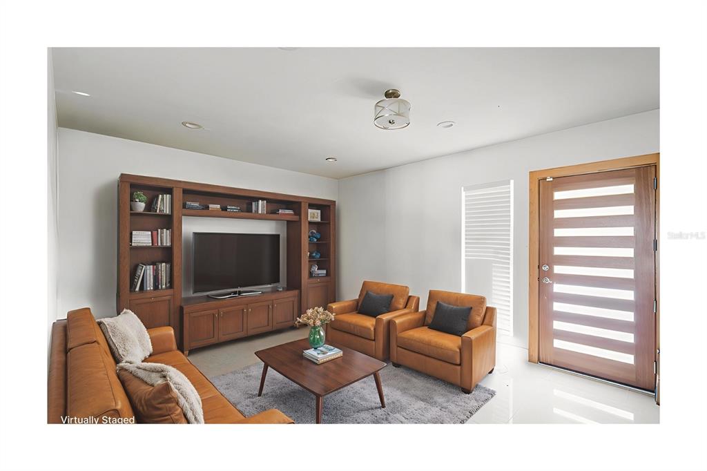 104 Druid Hills Road Temple Terrace, FL 33617 - Photo 5 of 22 a living room with furniture and a flat screen tv