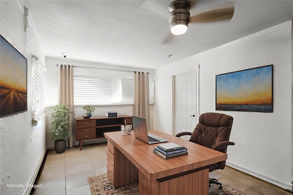 104 Druid Hills Road Temple Terrace, FL 33617 - Photo 6 of 22 a living room with furniture and a flat screen tv