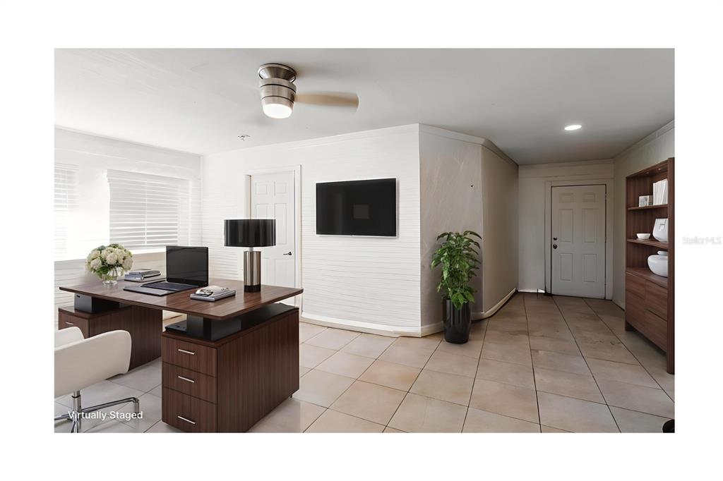 104 Druid Hills Road Temple Terrace, FL 33617 - Photo 7 of 22 a living room with furniture and a flat screen tv