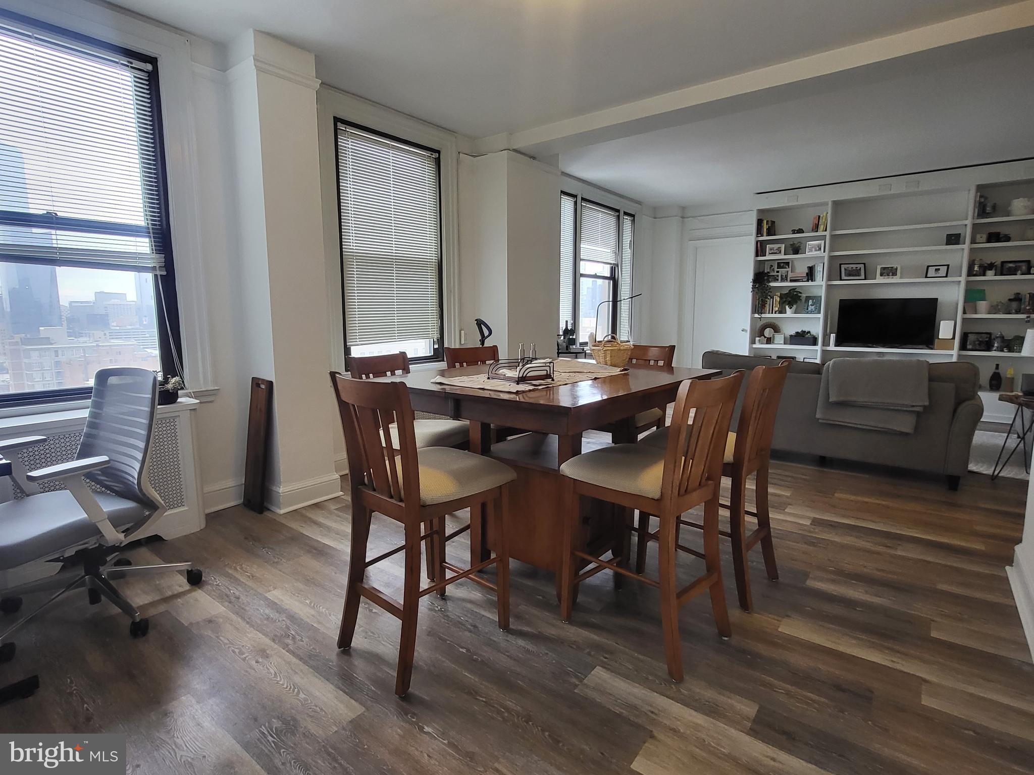2031 Locust Street, Unit 1503 Philadelphia, PA 19103 - Photo 2 of 24 a view of a dining room with furniture window and wooden floor