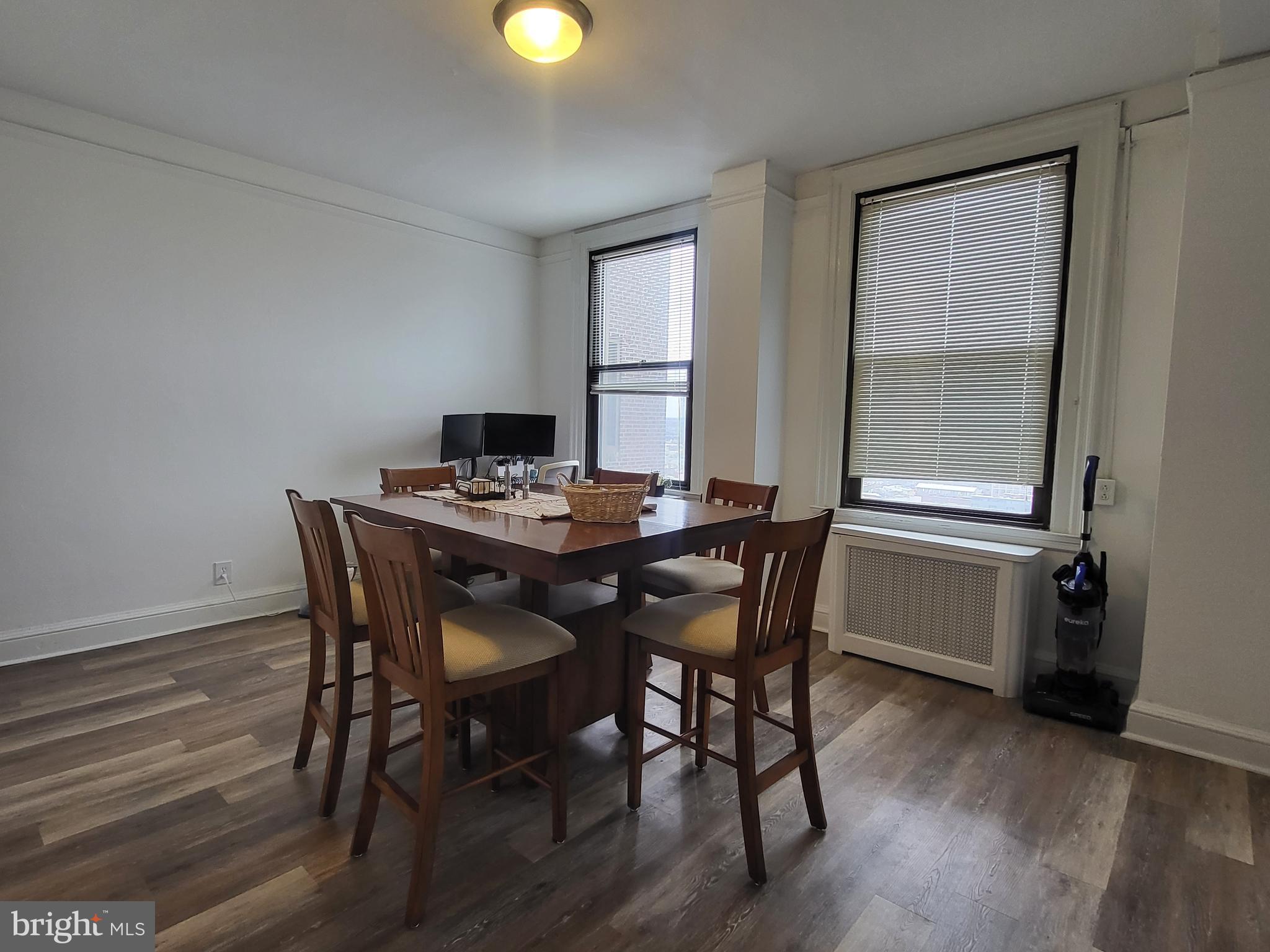2031 Locust Street, Unit 1503 Philadelphia, PA 19103 - Photo 4 of 24 a dining room with furniture and window