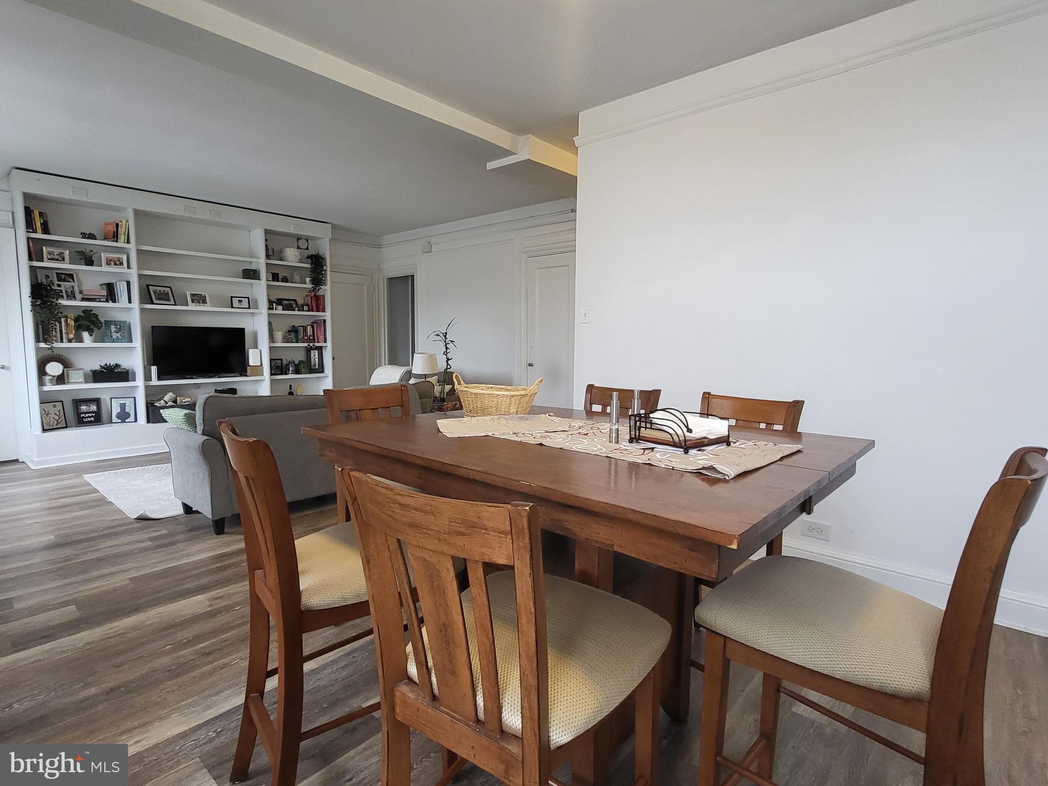 2031 Locust Street, Unit 1503 Philadelphia, PA 19103 - Photo 5 of 24 a view of a dining room with furniture and wooden floor