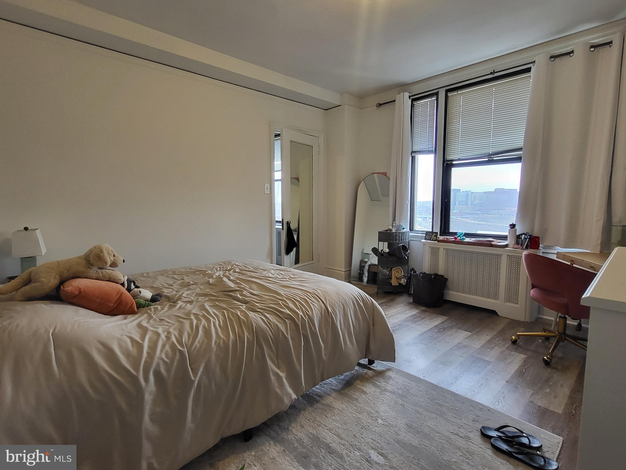 2031 Locust Street, Unit 1503 Philadelphia, PA 19103 - Photo 9 of 24 a bedroom with a bed a desk and chair