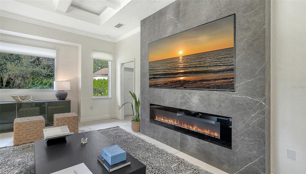 3415 162nd Avenue East Parrish, FL 34219 - Photo 14 of 49 a living room with furniture and a flat screen tv