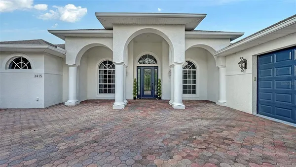 a view of a house with an entryway and a fireplace
