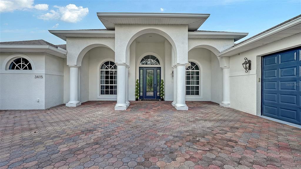 3415 162nd Avenue East Parrish, FL 34219 - Photo 2 of 49 a view of a house with an entryway and a fireplace