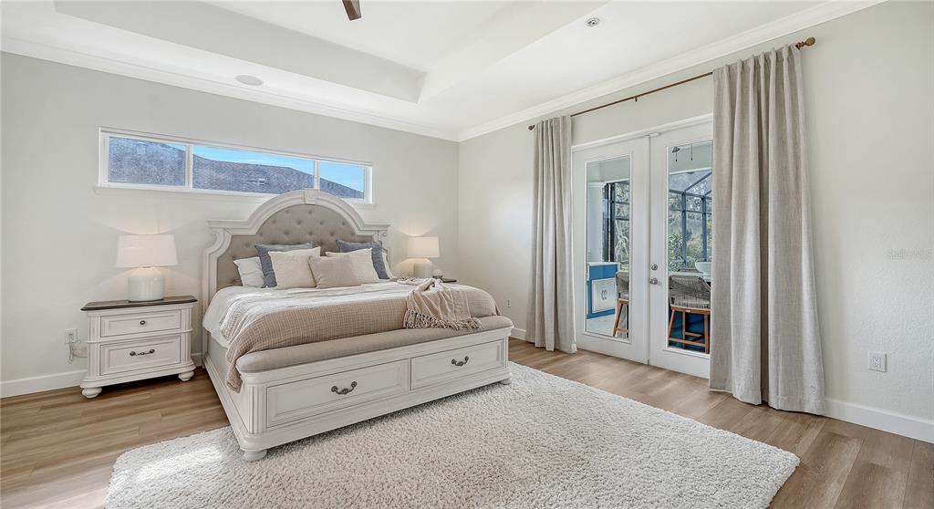 3415 162nd Avenue East Parrish, FL 34219 - Photo 23 of 49 a bedroom with a bed and a dresser