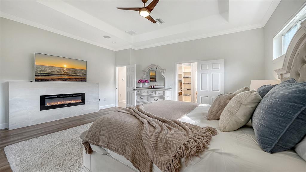 3415 162nd Avenue East Parrish, FL 34219 - Photo 24 of 49 a bedroom with a bed and a flat screen tv