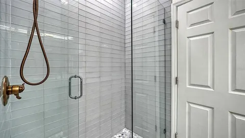 a bathroom with a granite countertop sink mirror and double