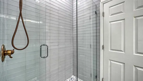 a bathroom with a granite countertop sink mirror and double