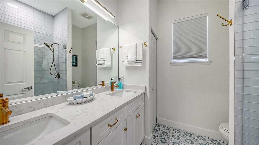 3415 162nd Avenue East Parrish, FL 34219 - Photo 34 of 49 a bathroom with a granite countertop sink mirror and double
