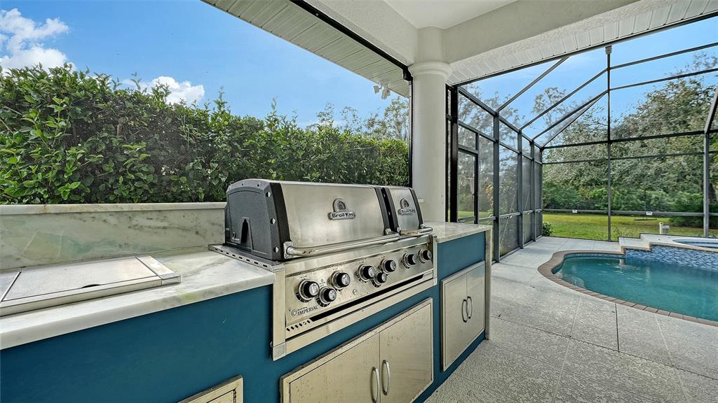 3415 162nd Avenue East Parrish, FL 34219 - Photo 39 of 49 a kitchen with a stove and a sink