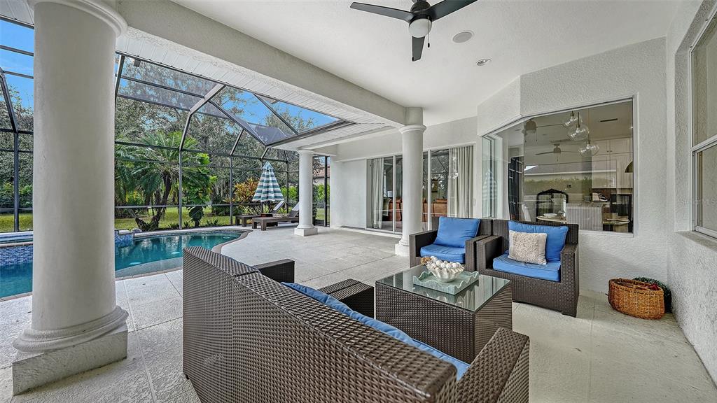 3415 162nd Avenue East Parrish, FL 34219 - Photo 40 of 49 a living room with furniture and a floor to ceiling window