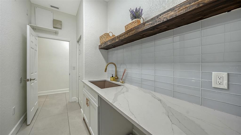 3415 162nd Avenue East Parrish, FL 34219 - Photo 43 of 49 a utility room with a sink