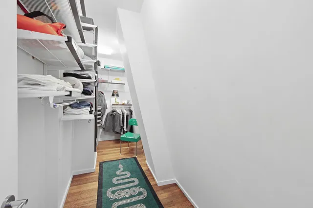 a bedroom with furniture and window