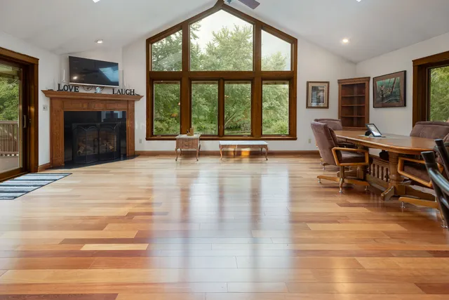 a view of a livingroom with furniture and a fireplace
