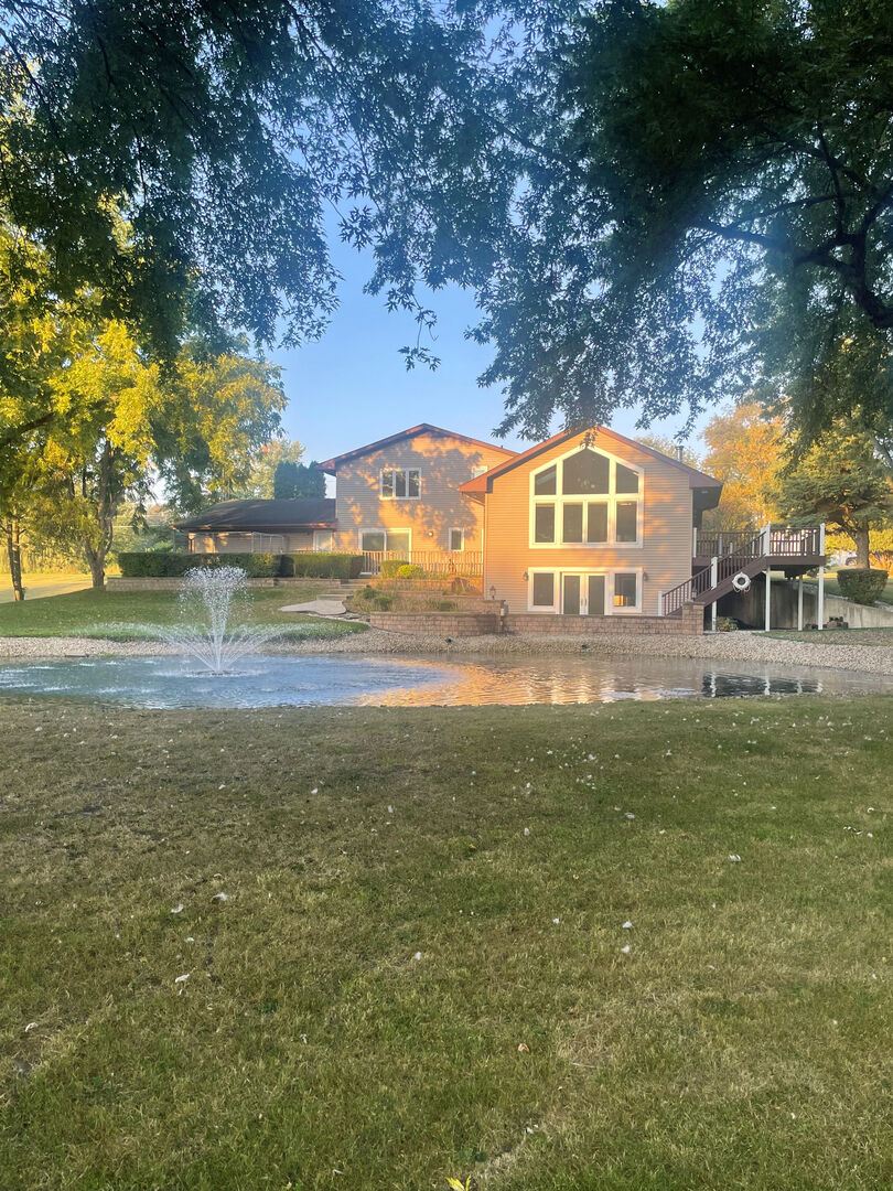 5857 South Brooklyn Road Rochelle, IL 61068 - Photo 7 of 31 a view of a house with a yard