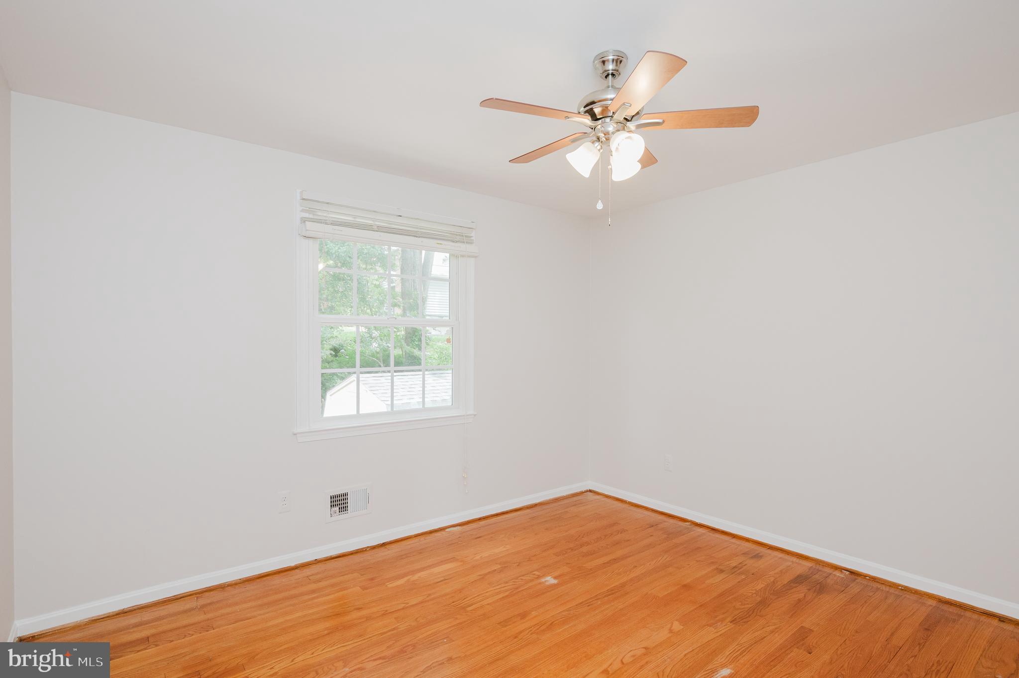 4 Old Spring Court Cockeysville, MD 21030 - Photo 40 of 53 an empty room with a window and a fan