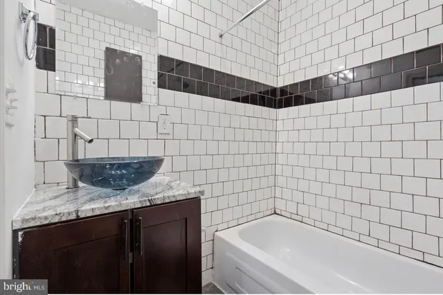 a view of a kitchen with a sink