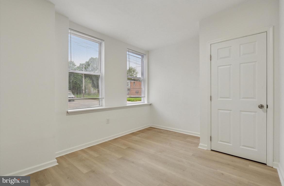 1999 Church Lane, Unit 1 Philadelphia, PA 19141 - Photo 10 of 10 an empty room with windows
