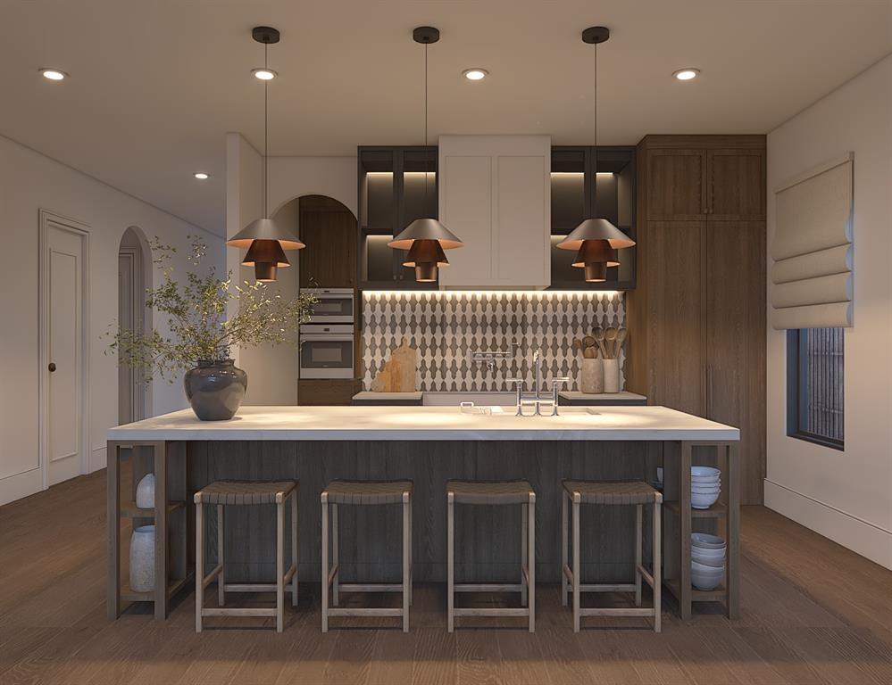 6629 Lockheed Avenue Dallas, TX 75209 - Photo 2 of 11 a kitchen with a table chairs refrigerator and microwave