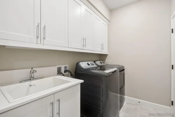 a view of a patio with a table and chairs