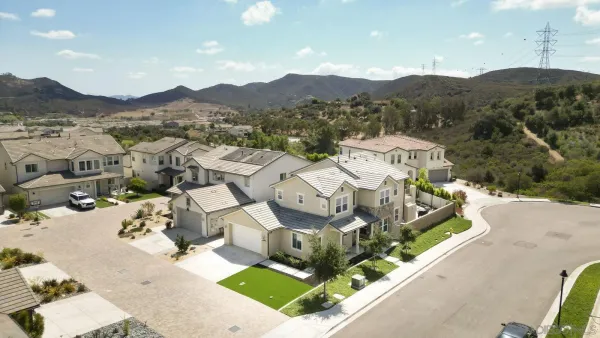 an aerial view of residential houses with outdoor space