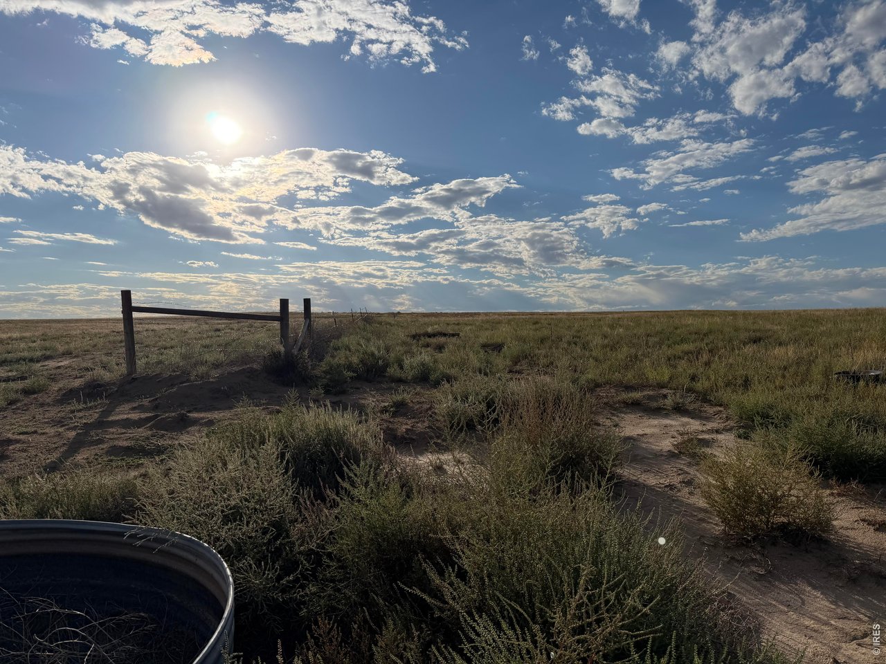 93 Weld County Rd Orchard Orchard, CO 80649 - Photo 1 of 7 Southeast corner of property fence line running along south side of property, looking west.