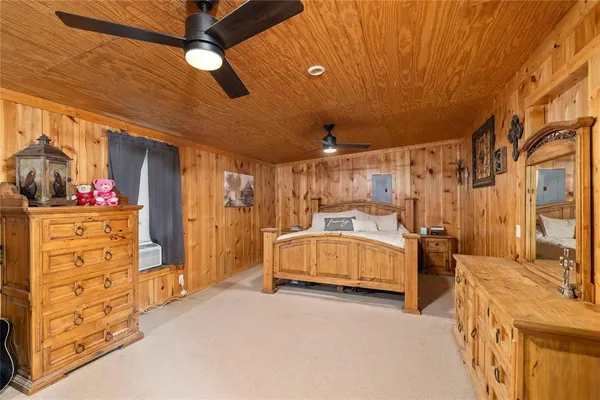 a bedroom with bed and a walk in closet