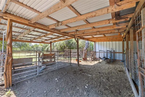 a view of empty room with wooden ceiling