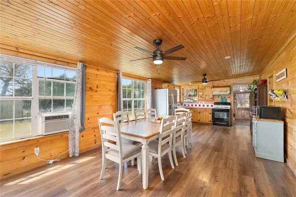 a view of a dining room with furniture window and wooden floor
