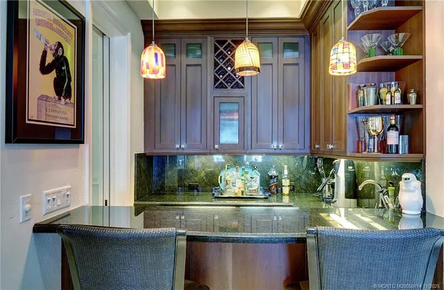 a living room with furniture flat screen tv and wooden floor